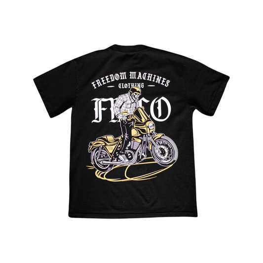 Black shirt heavy weight material small FMCO logo on front left of shirt and large print on back. Back of shirt has a skeleton doing a burnout on a motorcycle with Freedom Machines Clothing in print made in the USA