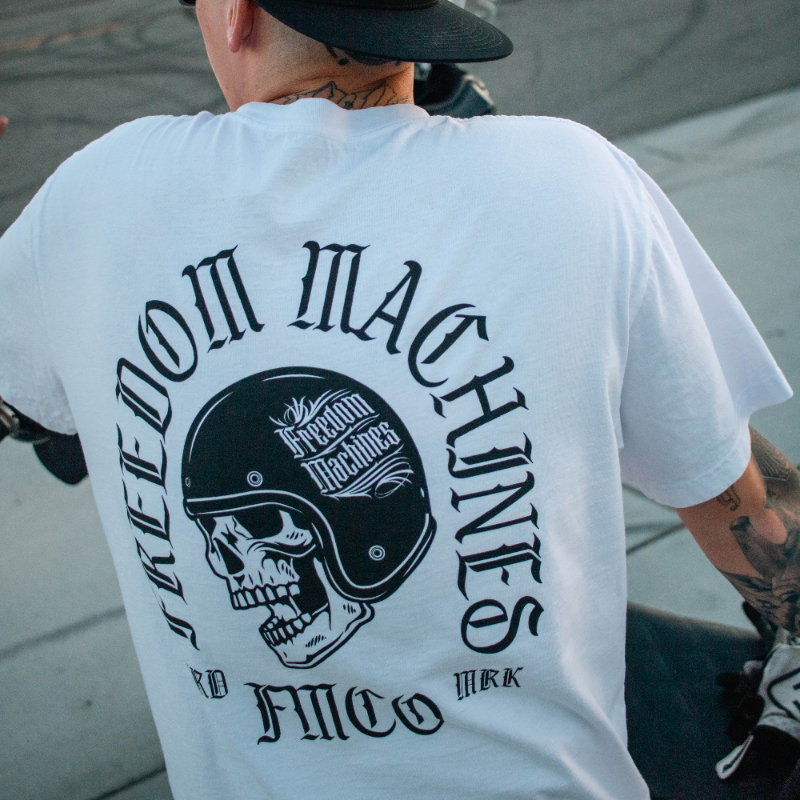 white t shirt with black script and design print a skull wearing a 3/4 helmet that says freedom machines heavy weight made in the usa 